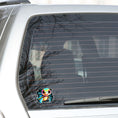 Load image into Gallery viewer, This image shows the baby sea turtle sticker on the back window of a car.