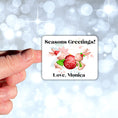 Load image into Gallery viewer, This image shows a hand holding the Personalized Holiday Stickers - Bunny Greetings.