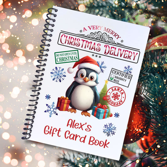 This image shows the cover of the Personalized Christmas Gift Card Book with Stickers and PVC Cover - Christmas Penguin.