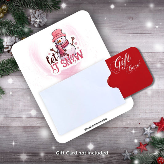 This image shows a gift card partially inside the Let it Snow Gift Card Holder Money Card.