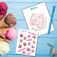 Load image into Gallery viewer, This image shows the Chibi Monkey notepad with a sample pen (pen colors are randomly selected to complement each note pad), and the included sticker sheet as part of the Animals with Ice Cream Notepads.