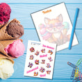 Load image into Gallery viewer, This image shows the Chibi Fox notepad with a sample pen (pen colors are randomly selected to complement each note pad), and the included sticker sheet as part of the Animals with Ice Cream Notepads.