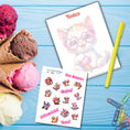 Load image into Gallery viewer, This image shows the Chibi Cat notepad with a sample pen (pen colors are randomly selected to complement each note pad), and the included sticker sheet as part of the Animals with Ice Cream Notepads.