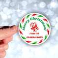 Load image into Gallery viewer, This image shows the personalized holiday sticker being held on one finger over a background of bubbles.