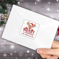 Load image into Gallery viewer, This image shows the Personalized Holiday Stickers - Merry Reindeer on the back of an envelope.