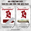 Load image into Gallery viewer, This image shows how to attach the money tube to the Congratulations Kissing Couple Money Card Kit.