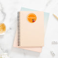 Load image into Gallery viewer, This image shows the personalized school sticker on a notebook.