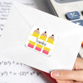 Load image into Gallery viewer, This image shows the personalized school sticker on the back of an envelope.