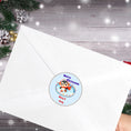Load image into Gallery viewer, This image shows the Personalized Holiday Stickers - Penguin Christmas on the back of an envelope.