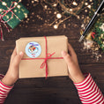 Load image into Gallery viewer, This image shows a package with the Personalized Holiday Stickers - Penguin Christmas on it.
