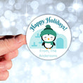 Load image into Gallery viewer, This image shows a hand holding the Personalized Holiday Stickers - Penguin Holidays.