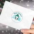 Load image into Gallery viewer, This image shows the Personalized Holiday Stickers - Penguin Holidays on the back of an envelope.