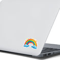 Load image into Gallery viewer, This image shows the rainbow and hearts sticker on the back of and open laptop.