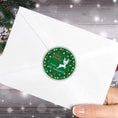 Load image into Gallery viewer, This image shows the Personalized Holiday Stickers - Reindeer Holidays on the back of an envelope.