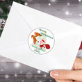 Load image into Gallery viewer, This image shows the Personalized Holiday Stickers - Santa & Reindeer on the back of an envelope.
