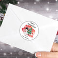 Load image into Gallery viewer, This image shows the Personalized Holiday Stickers - Snowman Christmas on the back of an envelope.