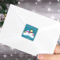 Load image into Gallery viewer, This image shows the Personalized Holiday Stickers - Snowman Family Holiday on the back of an envelope.