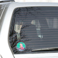 Load image into Gallery viewer, This image shows the starry wolf sticker on the back window of a car.