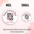 Load image into Gallery viewer, This image shows medium and small personalized valentine stickers next to each other as a size comparison.