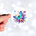 Load image into Gallery viewer, This image shows a hand holding the Blue and Purple Butterfly with Stars Die-Cut Sticker.