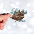 Load image into Gallery viewer, This image shows a hand holding the Steampunk Airship 2 Die-Cut Sticker