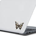 Load image into Gallery viewer, This image shows the Steampunk Butterfly 3 Die-Cut Sticker on the back of an open laptop.
