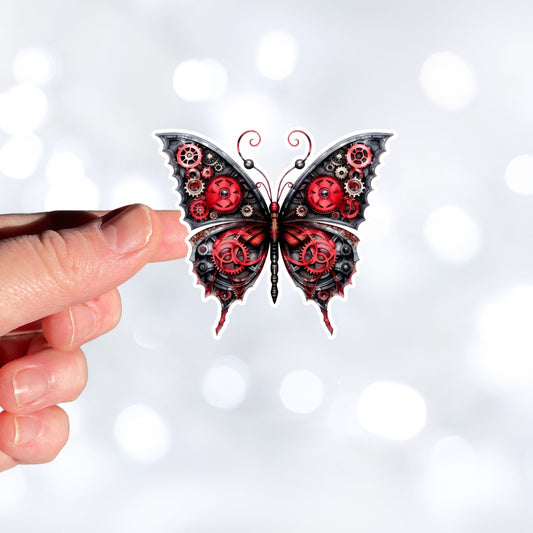 This image shows a hand holding the Steampunk Butterfly 5 Die-Cut Sticker.