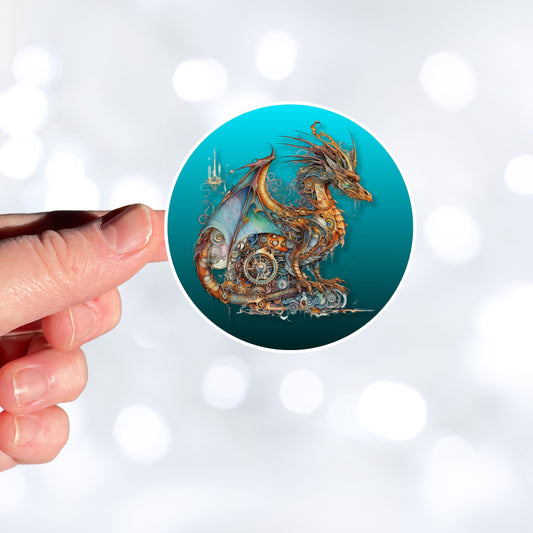 This image shows a hand holding the steampunk dragon with a blue background sticker.