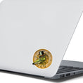 Load image into Gallery viewer, This image shows the steampunk grasshopper sticker on the back of an open laptop.
