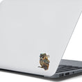 Load image into Gallery viewer, This image shows the steampunk owl sticker on the back of an open laptop.
