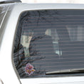 Load image into Gallery viewer, This image shows the steampunk rose sticker on the back window of a car.