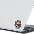 Load image into Gallery viewer, This image shows the Steampunk Skull 2 Die-Cut Sticker on the back of an open laptop.