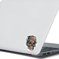 Load image into Gallery viewer, This image shows the Steampunk Skull 4 Die-Cut Sticker on the back of an open laptop.