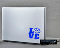 Load image into Gallery viewer, Love your pets? Then show it with this paw love square! Available in 4 sizes and 10 colors, these vinyl decals make great gifts for everyone. This image shows the Paw Love Square on the back of an open laptop..