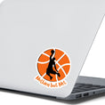 Load image into Gallery viewer, Dunk that basketball! This individual die cut sticker features a silhouette of someone about to dunk a ball, on a basketball background, with the words "Nothing but Net" at the bottom. This image show the basketball sticker on the back of an open laptop.