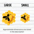 Load image into Gallery viewer, Bee Happy! This individual die-cut sticker is a great motivator. It features a honeycomb background with the silhouette of a bee and the word happy - enough said! This image shows large and small Bee Happy stickers next to each other.