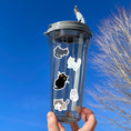 Load image into Gallery viewer, This sticker sheet is purrfect for all cat lovers! It has stickers of 12 different cute and cuddly cats, plus two pawprint stickers. This image shows a water bottle with five of the cat stickers applied to it.