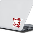Load image into Gallery viewer, Feelin Crabby? Naw, but sometimes this die cut sticker of a crab is just right for nearly everyone! This image show the Feelin Crabby die-cut sticker on the back of an open laptop.