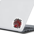 Load image into Gallery viewer, This guitar sticker is great for any guitarist, whether a beginner or a seasoned shredder! This individual die-cut sticker features a burgundy electric guitar on a gray and burgundy paint splattered background. Turn it up! This image shows the guitar sticker on the back of an open laptop.