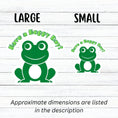 Load image into Gallery viewer, This inspirational sticker features a smiling frog with "Have a Hoppy Day!" written above. This image shows large and small Have a Hoppy Day stickers next to each other.