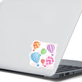 Load image into Gallery viewer, Float away on a colorful hot air balloon! This individual die-cut hot air balloon sticker has six, yes six, different hot air balloons on a background of clouds. This image shows the hot air balloon sticker on the back of an open laptop.