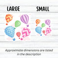 Load image into Gallery viewer, Float away on a colorful hot air balloon! This individual die-cut hot air balloon sticker has six, yes six, different hot air balloons on a background of clouds. This image shows large and small hot air balloon stickers next to each other.