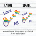 Load image into Gallery viewer, This gnome is showing his Pride! With the words "Love All", this individual die-cut sticker features a gnome with a rainbow hat and rainbow heart balloons. This image shows large and small Gnome Love All stickers next to each other.