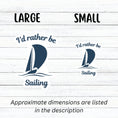 Load image into Gallery viewer, This individual die-cut sticker is great for anyone who loves to sail! It features a blue sailboat with the words "I'd rather be Sailing". This sailing sticker is understated, but says a lot! This image shows large and small I'd rather be Sailing stickers next to each other.