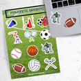 Load image into Gallery viewer, What are your favorite sports? Football, gymnastics, soccer, volleyball, cheer, baseball, hockey, tennis, or lacrosse? If you love any of these then this sticker sheet is perfect for you! This image shows the Favorite Sports sticker sheet next to a laptop with hockey goalie and football stickers applied below the keyboard.