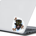 Load image into Gallery viewer, Steampunk Monkey has his own version of a steampunk hat and goggles, plus he is wearing goggles and surrounded by three steampunk butterflies. All on a blue and white background. This image shows the steampunk monkey sticker on the back of an open laptop.