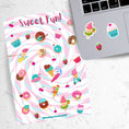 Load image into Gallery viewer, This sticker sheet is such Sweet Fun! It features cartoon characters of all your favorite treats like ice cream, donuts, and cakes. Delicious! This image shows the Sweet Fun sticker sheet next to a laptop with sticker images of an ice cream cone with a water float ring, a smiling cupcake, and a chocolate dipped strawberry applied below the keyboard.