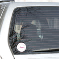 Load image into Gallery viewer, This round individual die-cut sticker is Sweet! It features the word Sweet in the center surrounded by pink and purple circular dots. This makes a great gift for anyone you're sweet on! This image shows the Sweet sticker on the back window of a car.