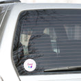 Load image into Gallery viewer, Sweet as Ice Cream! This round individual die-cut sticker has the word Sweet with two ice cream bars in the center surrounded by pink and purple circular dots. This makes a great gift for your sweetie! This image shows the Sweet - Ice Cream die-cut sticker on the back window of a car.