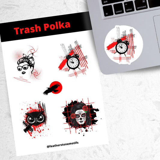 Trash Polka uses red, black, and white with a combination of abstract, surrealistic, and realistic images. This sticker sheet has four larger stickers from our die-cut sticker collection combined with a smaller sticker of a raven flying across a red sun. The stickers are the Trash Polka Woman's face, Trash Polka Clock, Trash Polka Owl, and Trash Polka Sugar Skull Woman. This image shows the sticker sheet next to an open laptop with the Trash Polka Clock sticker applied below the keyboard.